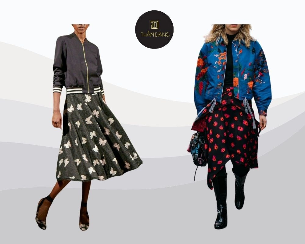 Mix chân váy hoa với áo khoác bomber tạo nên phong cách street style cá tính nhưng vẫn giữ được nét nữ tính.
